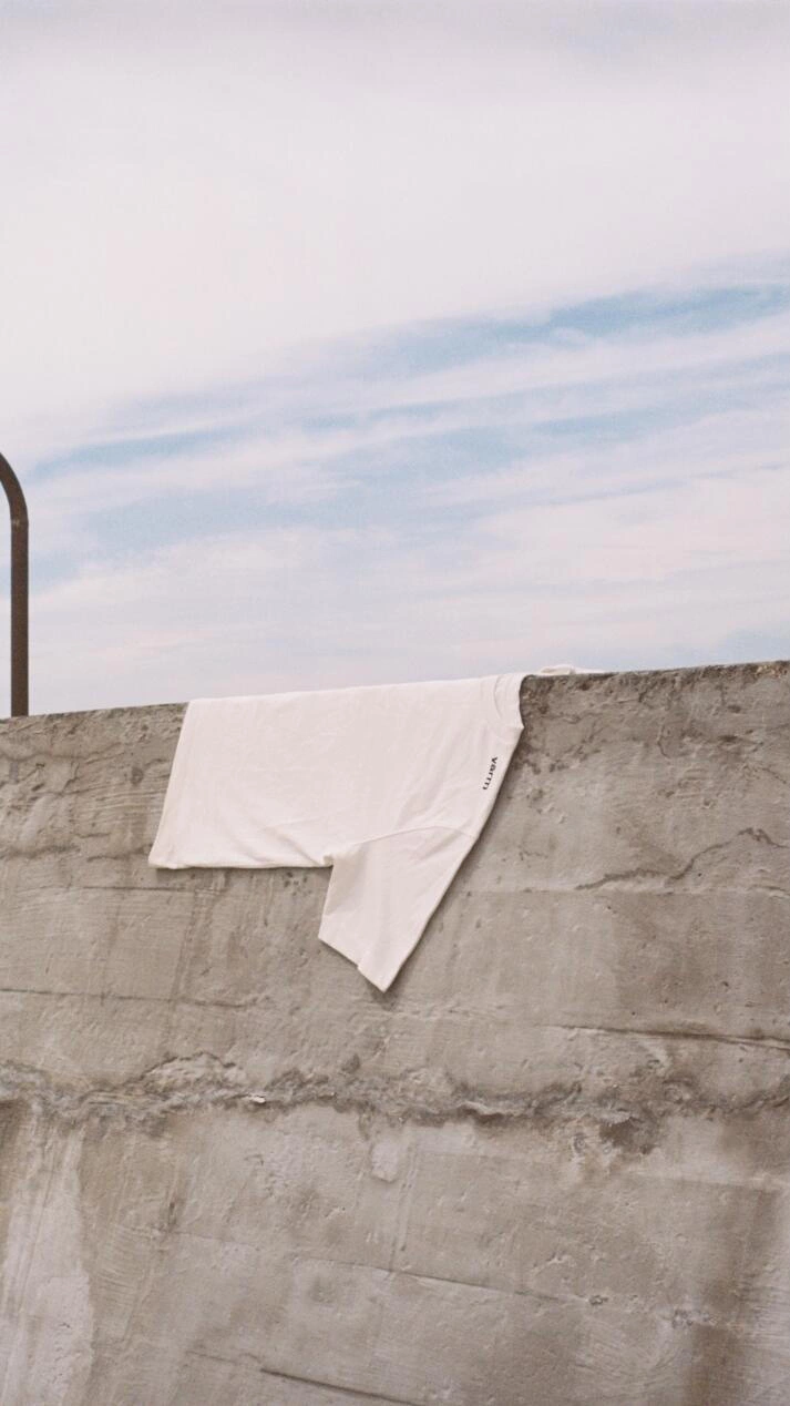 Shirt lying on concrete wall